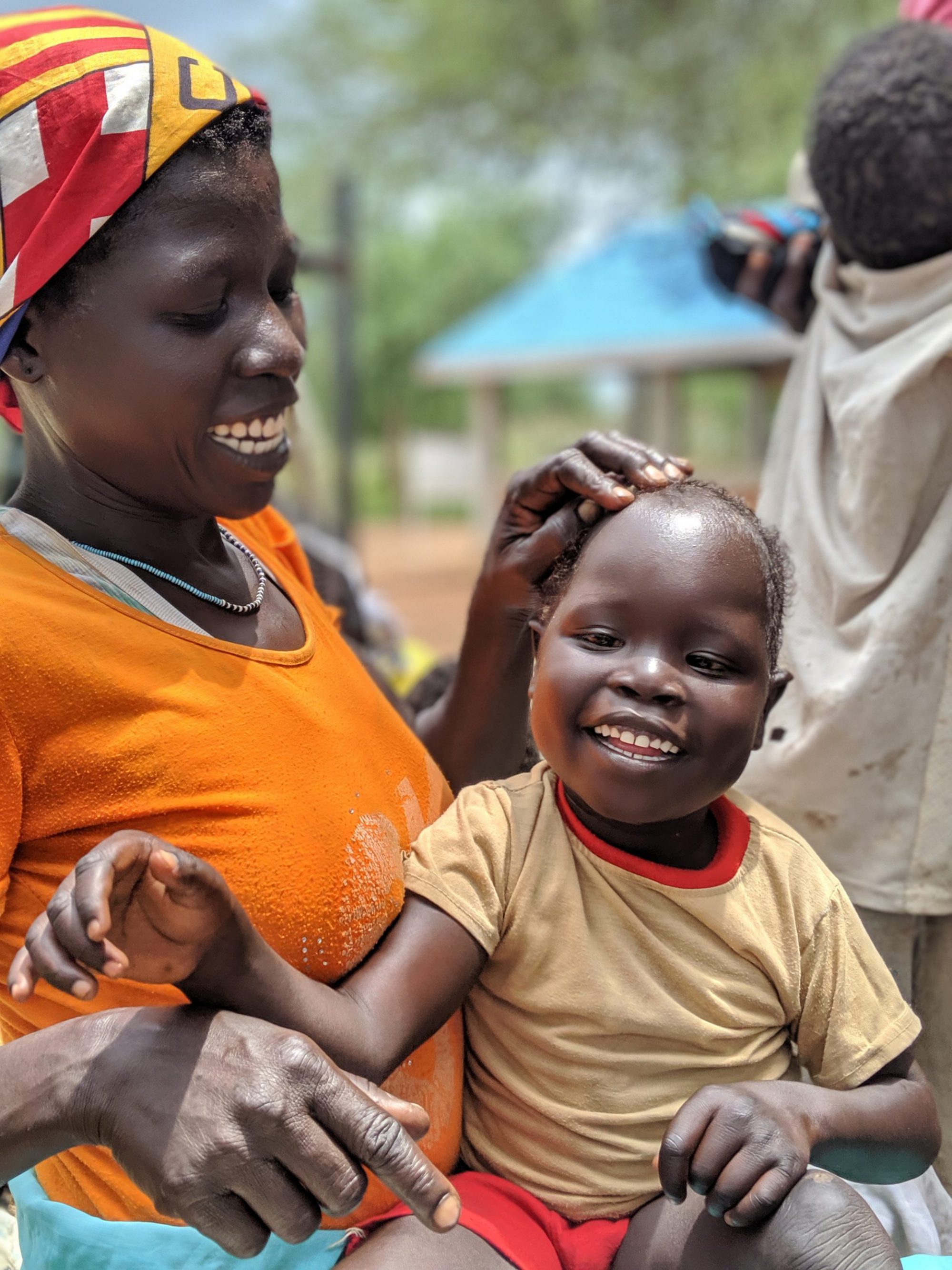 Mother Laughing With Child in Maban.