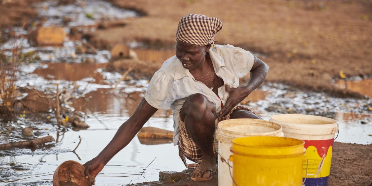 A woman scoops water from a puddle in Bunj, a town in Maban County, South Sudan. Maban is host to four refugee camps that together shelter more than 130,000 refugees from the Blue Nile region of Sudan. Jesuit Refugee Service, with support from Misean Cara, provides educational and psycho-social services to both refugees in the camps and the host community.